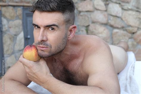 Seductive Naked Man Holding A Sensual Peach Stock Photo Adobe Stock