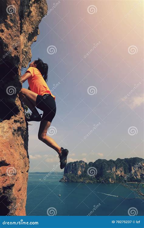 Woman Rock Climber Climbing At Seaside Mountain Rock Stock Image