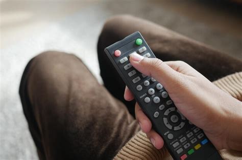 Premium Photo Close Up Of Women Hand Holding Tv Remote