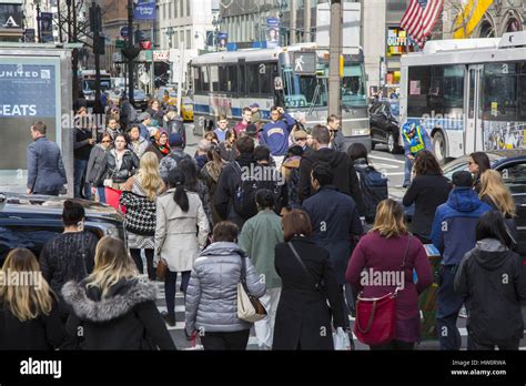 People At The Always Crowded Intersection Of 5th Avenue And 42nd Street