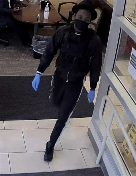 Detectives Investigate Bank Robbery In Bethesda Surveillance Photos Of