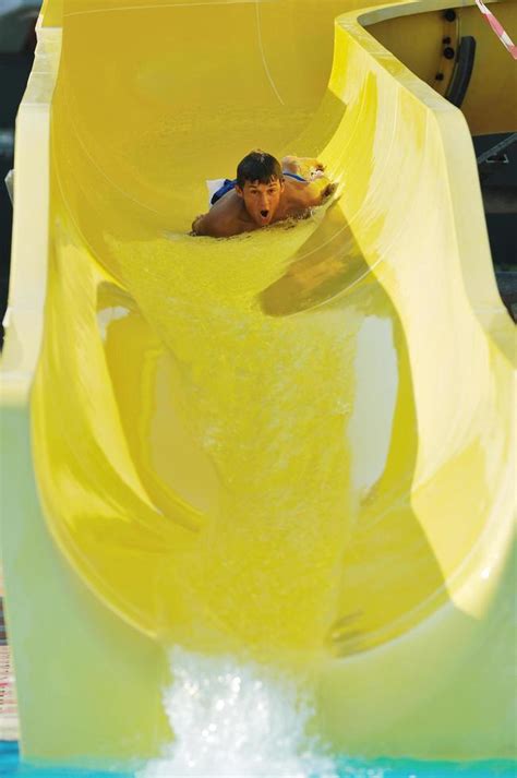 water slide fun on outdoor pool 11608542 Stock Photo at Vecteezy