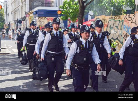 London, UK. 27th Aug, 2023. Police officers arrive on duty as Notting ...