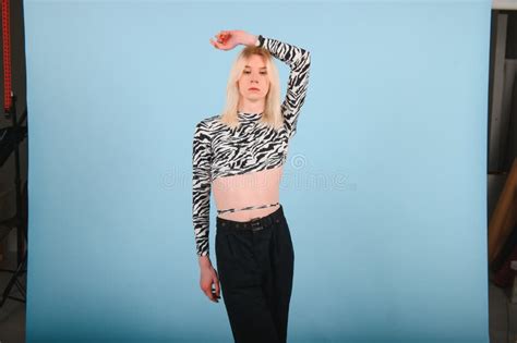 Youth Transgender LGBT Looking At Camera While Posing Isolated Over Nude Color Background Stock
