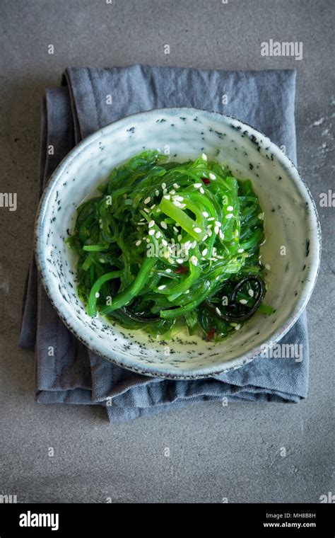 Chuka Seaweed Salad In Ceramic Bowl Over Concrete Background Copy