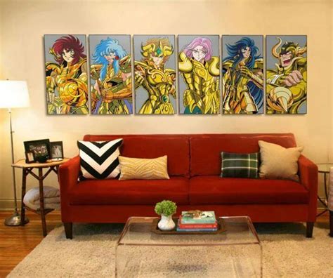 A Living Room Filled With Red Couches Covered In Pillows And Paintings