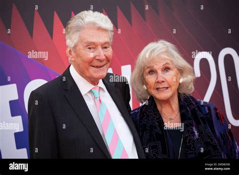 Timothy Carlton and Wanda Ventham pose for photographers upon arrival ...