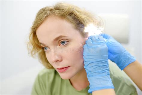 A Patient Is Seen By An Otolaryngologist A Professional ENT Doctor