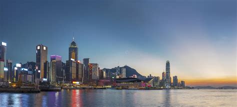 Panorama Of Victoria Harbor Of Hong Kong City Under Sunset Stock Photo