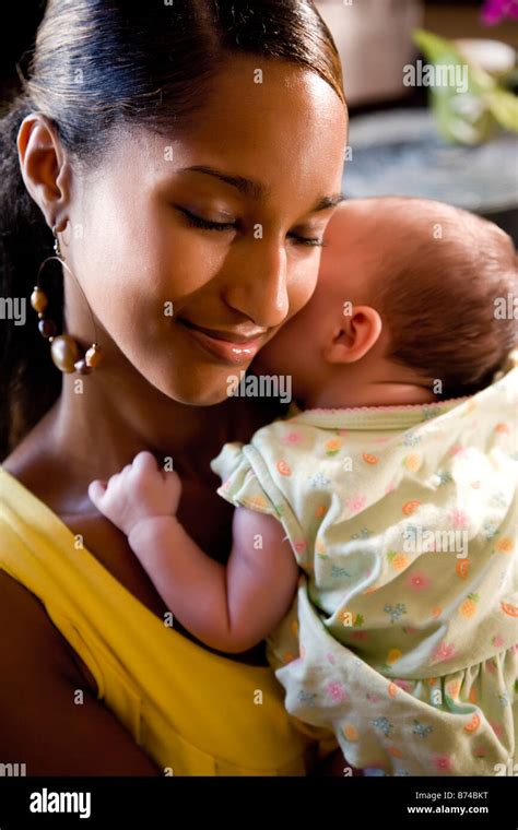 Young African American mother holding baby Stock Photo - Alamy