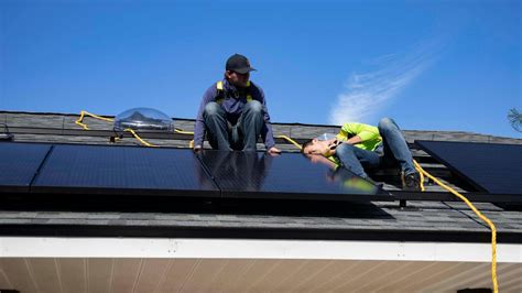 Men Installing Solar Panels on a Roof · Free Stock Photo