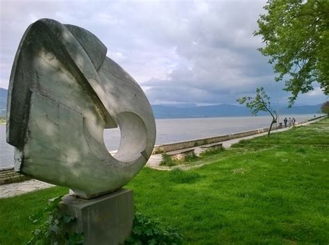 Free Images Grass Rock Lawn Shore Lake Wind Monument Walk