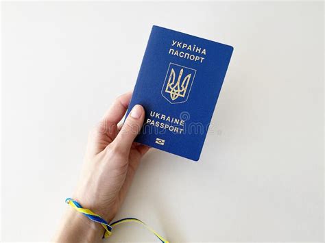 Ukrainian Passport In A Womanand X27 S Hand On A White Background With A