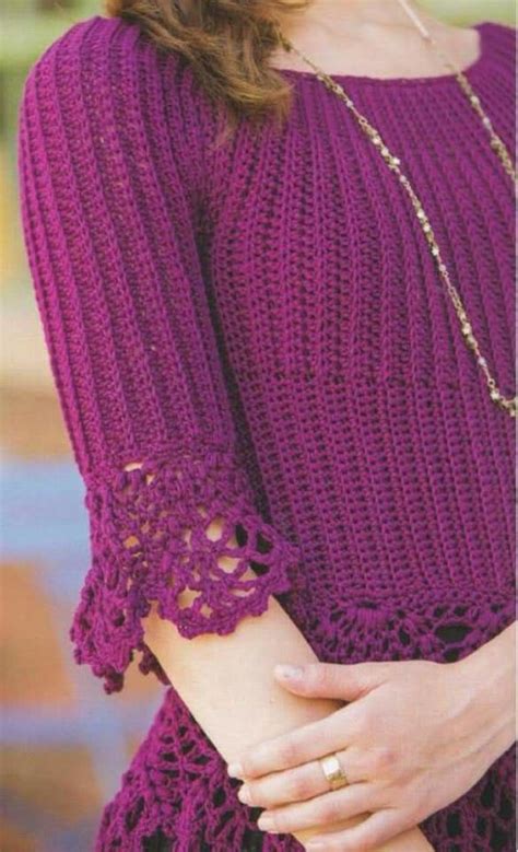 A Woman Wearing A Purple Sweater With Crocheted Sleeves