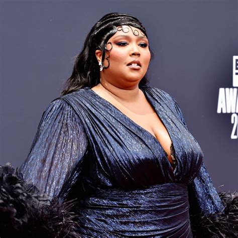 Lizzo Shows Off Her Feathered Sleeves And Thigh High Slit At The Bet