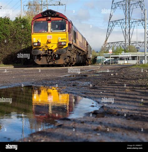 DB Cargo rail class 66 diesel locomotive 66053 hauling a freight train ...