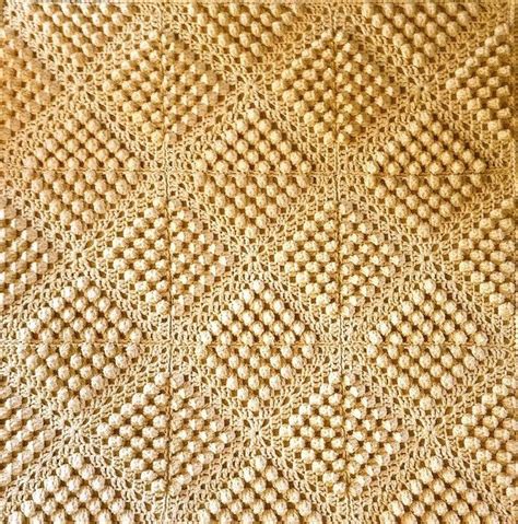 A Close Up View Of A Woven Material With Squares And Dots On The Bottom