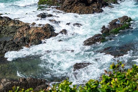 Premium Photo | Ocean waves breaking on the rocks on the beach