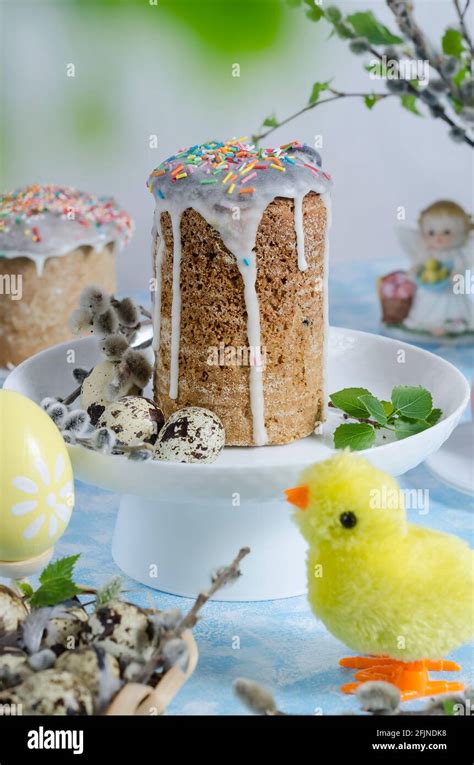 Easter Cake And Eggs On A Festive Table With Pussy Willow And Chicken On A Light Blue Background