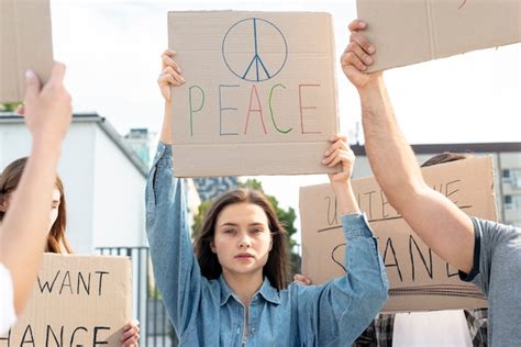 Free Photo Group Of Activists Marching For Peace