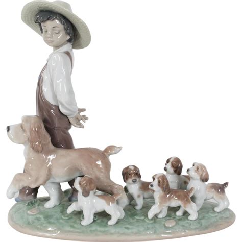 Sold At Auction Lladro Boy With Dogs Porcelain Figure