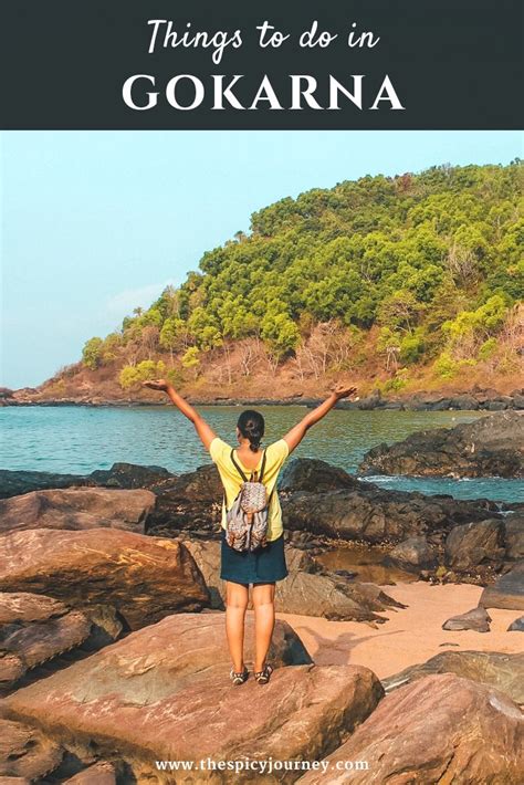 A Woman Standing On Rocks With Her Arms Up In The Air And Text That Reads Things To Do In Gokarna