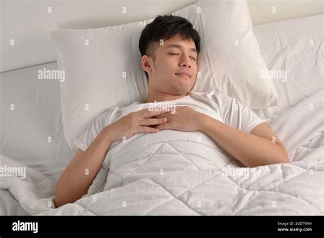 Handsome Young Asian Man Sleeping In Bed Stock Photo Alamy