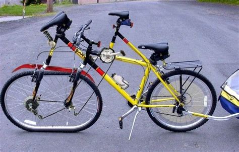 Two Bikes Parked Next To Each Other On The Street