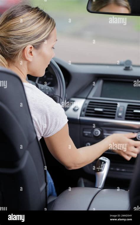 Woman Sets Up Car Radio Stock Photo Alamy