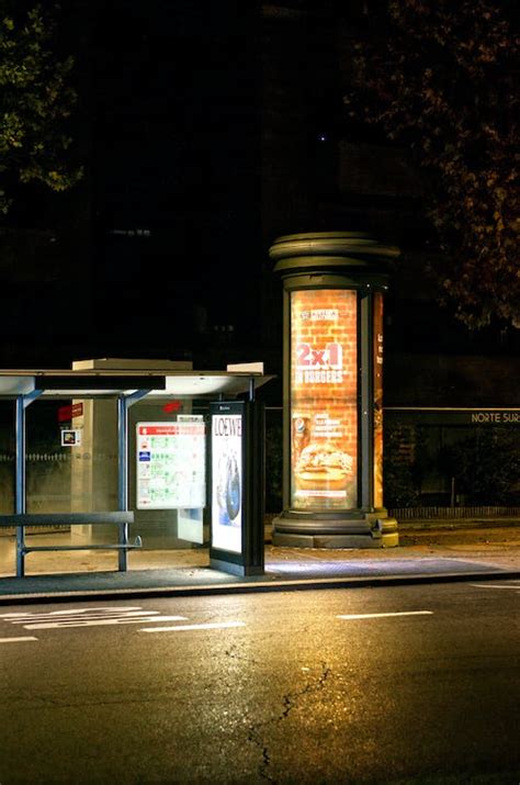 Illuminated Bus Stop on City at Night · Free Stock Photo