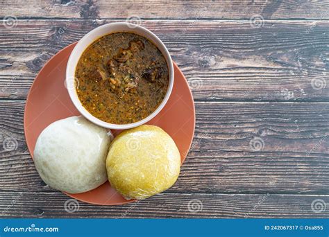 Garri And Pounded Yam Served With Ogbono Soup Ready To Eat Stock Image Image Of Okele Soup