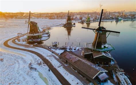 Zaanse Schans Windmill Village During Winter With Snow Landscape In The