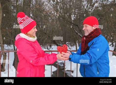 Mature Couple Have Date On Valentines In Winter Snowy Park Stock Photo Alamy