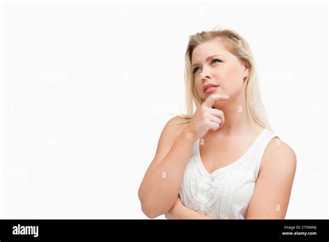 Blonde Woman Placing Her Fingers On Her Chin Stock Photo Alamy
