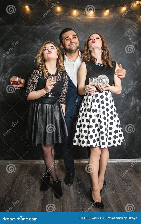 A Man And Two Girls Blonde And Brunette Talk At The Party Stock Image Image Of Handsome