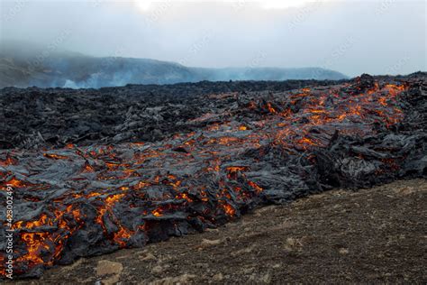 Fiery flowing lava. Volcano eruption at Fagradalsfjall, Iceland. Stock ...