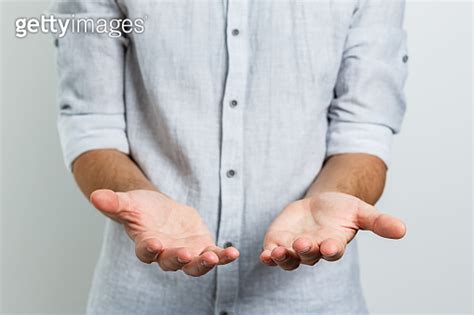 Open Palm Hand Gesture Of Male Hand Isolated On White Background