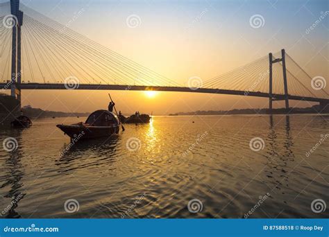 Scenic Sunset Over Vidyasagar Bridge with Wooden Boats on River Hooghly ...