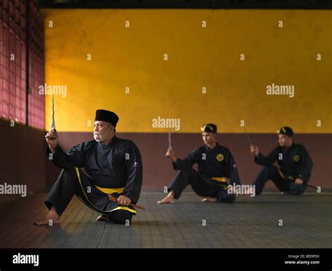 A Silat Master Preforming The Malaysian Martial Art Of Silat Stock