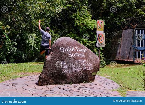 Man Stretching At Bukit Timah Hill Summit The Highest Point Of The