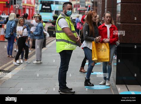 Staff Member Outside Penneys In Belfast City Centre Hi Res Stock