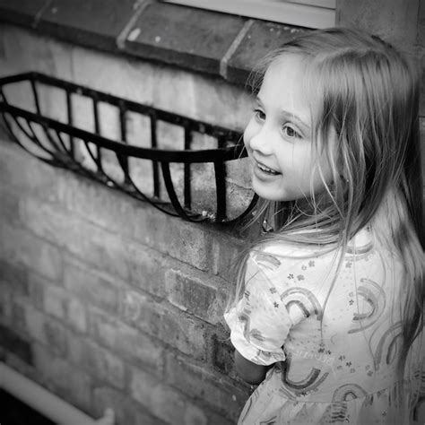 Premium Photo Portrait Of Smiling Girl Standing Outdoors