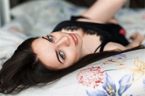 Beautiful Brunette Lying In Bed And Looking At The Camera Stock Image Image Of Luxury