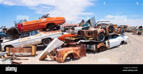 panorama of classic 1960s vintage American cars in Arizona junkyard ...