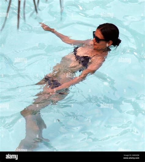 Katie Holmes Shows Off Her Slender Figure In A Black Bikini As She
