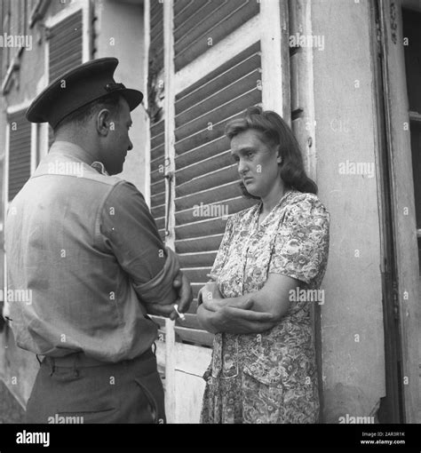 Land Traitors in France A woman is addressed by a uniformed man Date ...