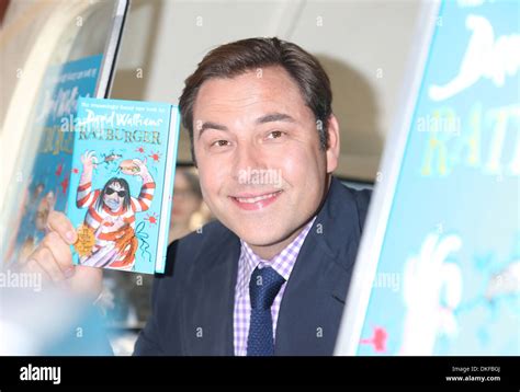 David Walliams promotes his new book entitled 'Ratburger' from a classic ice cream van outside ...