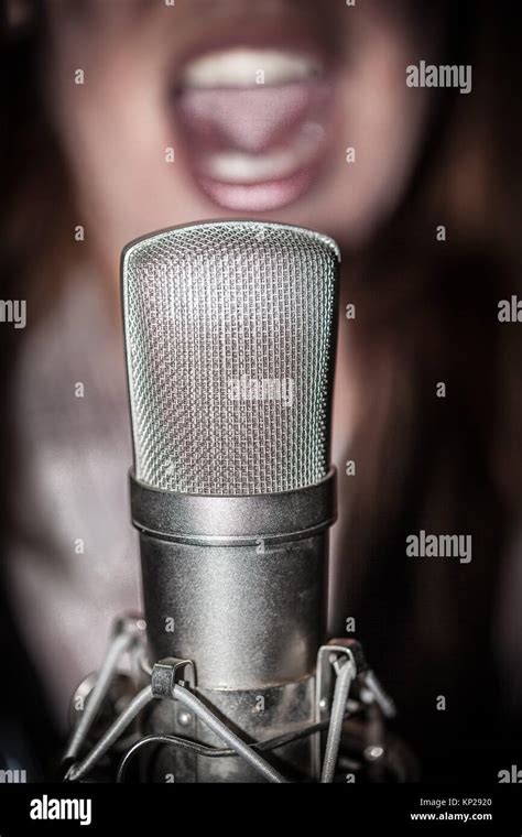 Woman Speaking Into Microphone Hi Res Stock Photography And Images Alamy