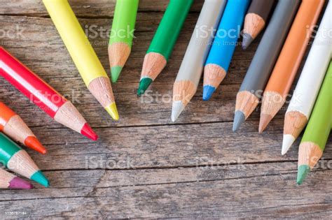 Creativity Colored Pencils In A Can On Rustic Wooden Table White