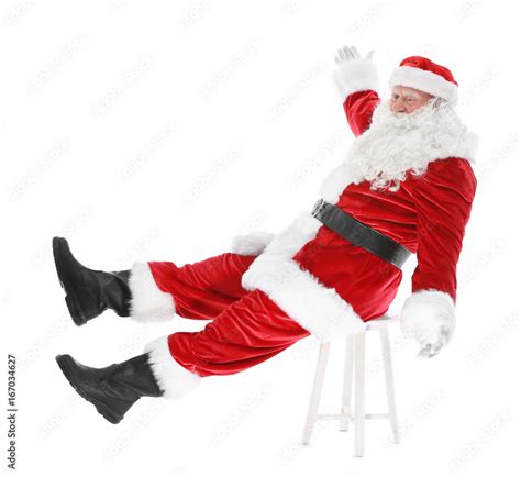 Authentic Santa Claus Sitting On Chair Against White Background Stock